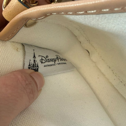 Close-up of a Disney Parks label on a interior of bag.