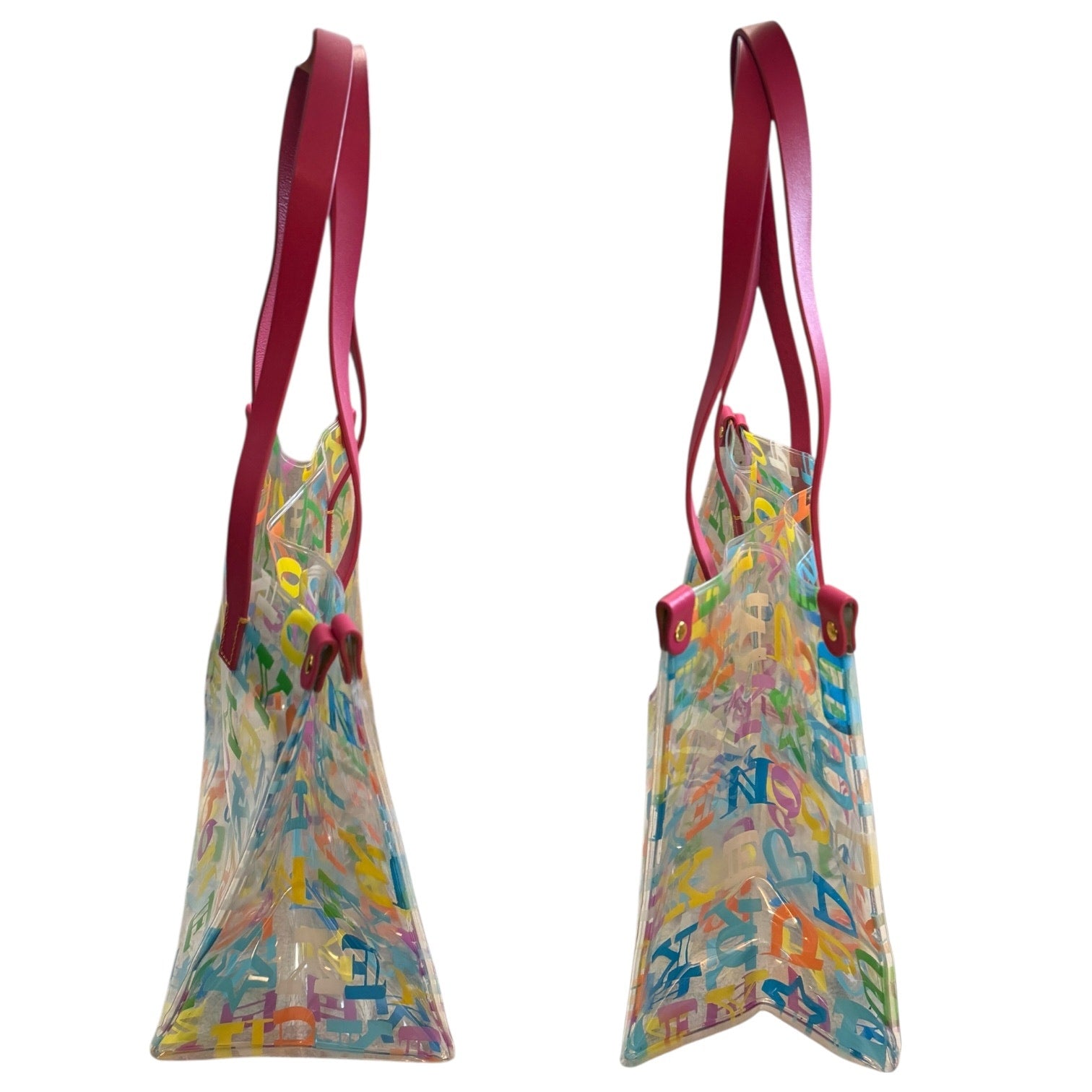 Side view of Clear bag with colorful letter pattern and pink handles on a white background