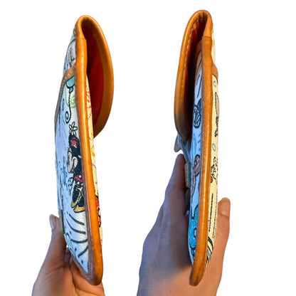 Sides of pouch with cartoon character design on a white background