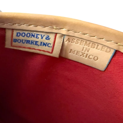 Dooney & Bourke label on a red fabric background