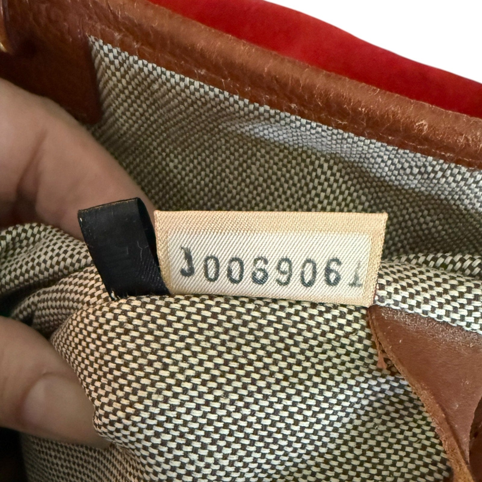 Close-up of a interior tag with numbers on a textured surface