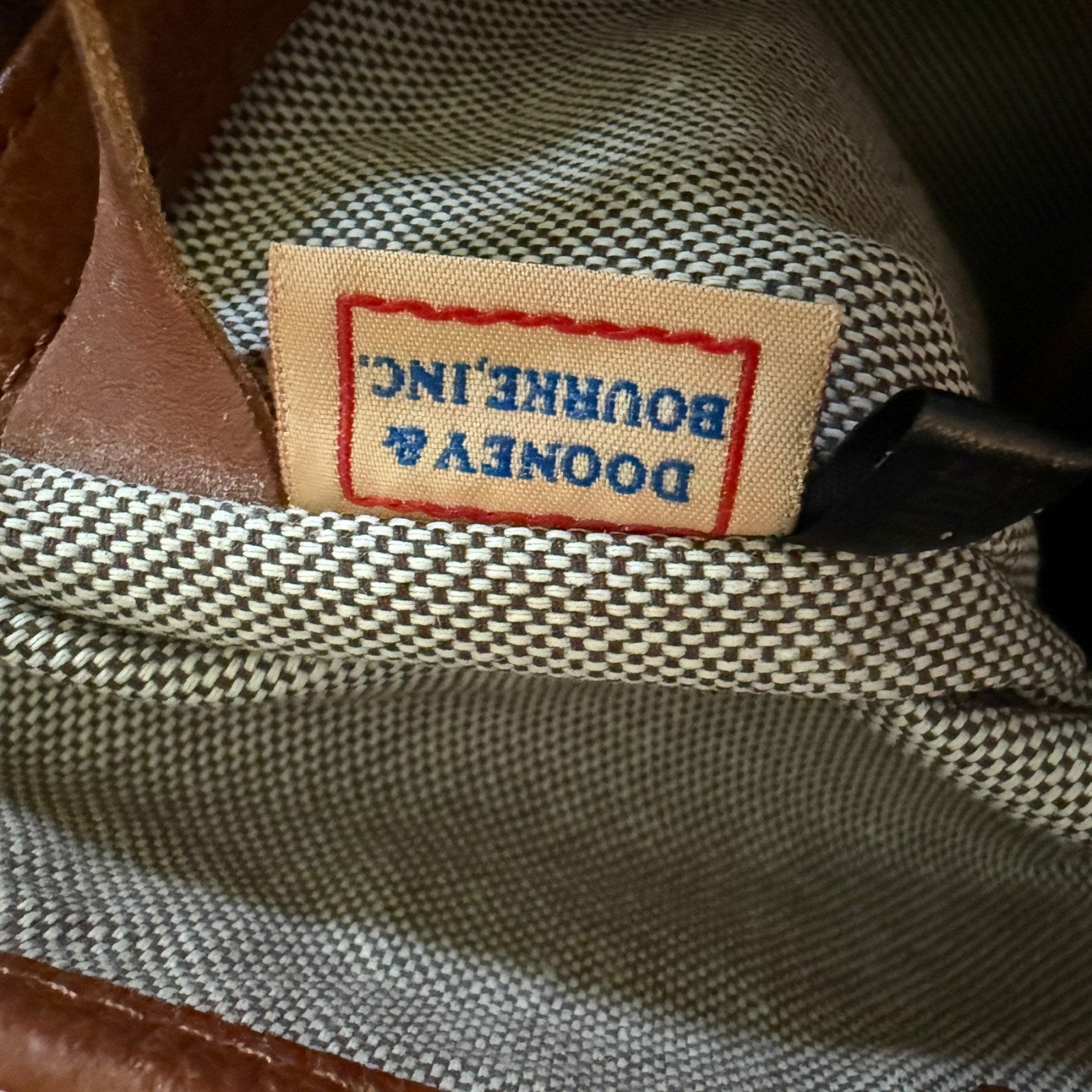 Close-up of a label on a textured fabric surface