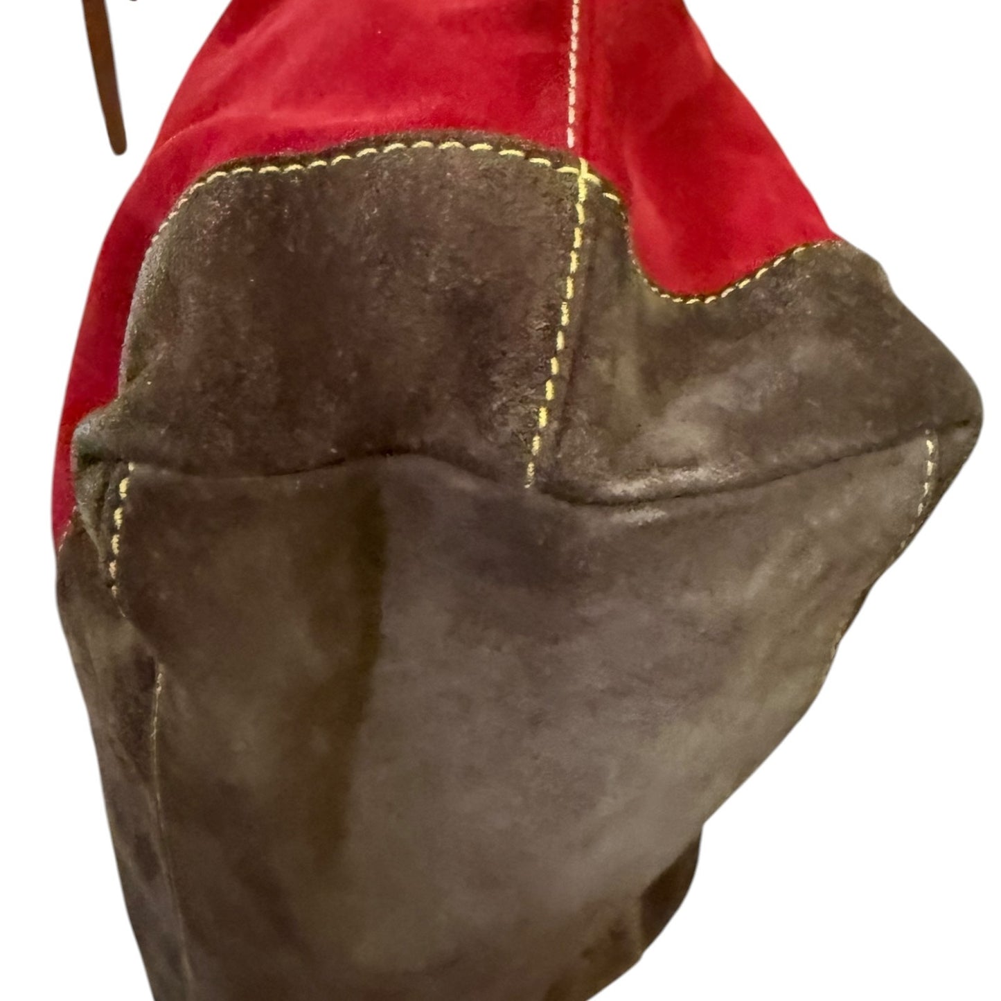 Close-up of a brown leather suede purse on a white background