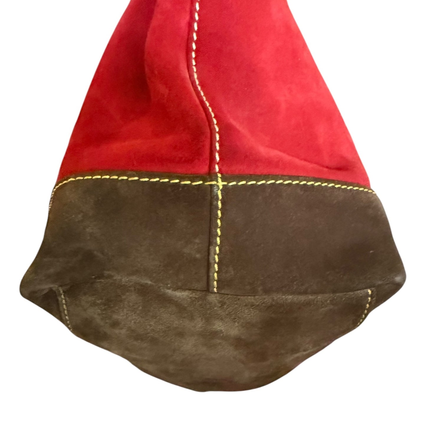 Red and brown suede purse corner on a white background