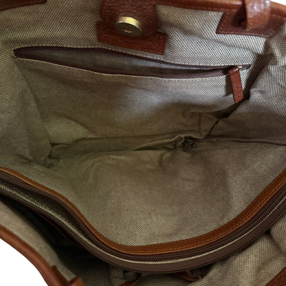 Interior of  bag with brown leather trim on a white background