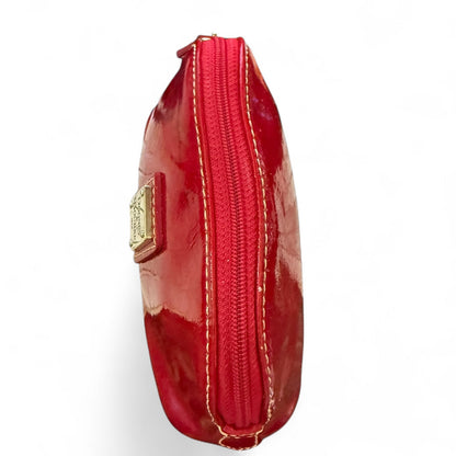 Top view of pouch with gold accents on a white background