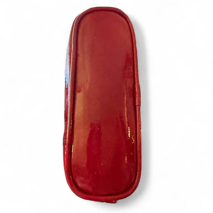 Bottom of red pouch on a white background