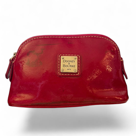 Red leather pouch with Dooney & Bourke logo on a white background