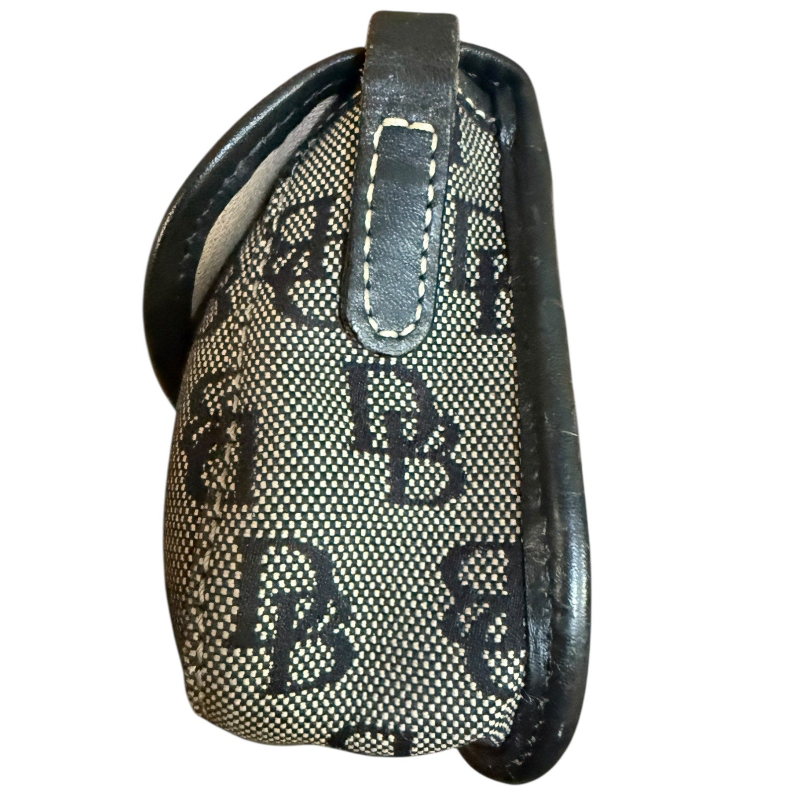 Side of Black and white patterned purse with 'DB' branding on a white background
