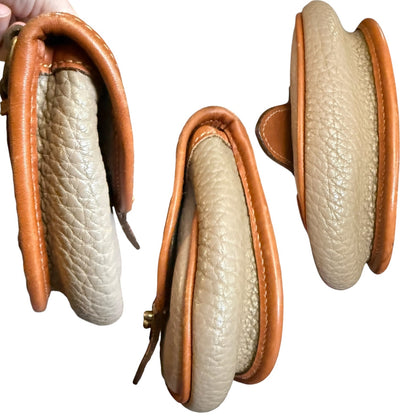 Side views of purse with brown trim on a white background