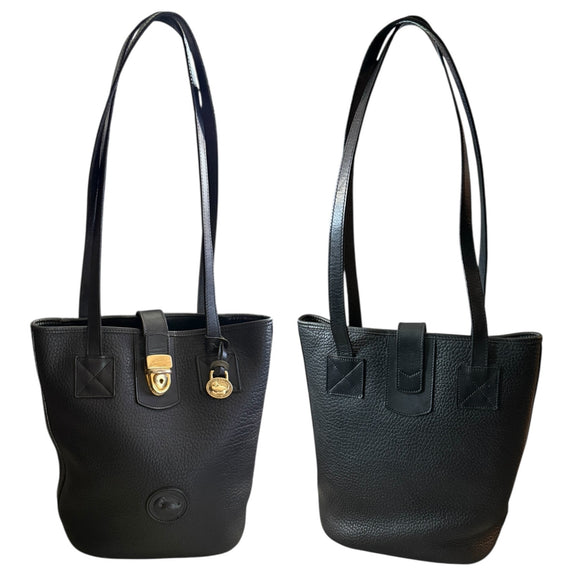 Front and back of black leather handbags with gold hardware on a white background