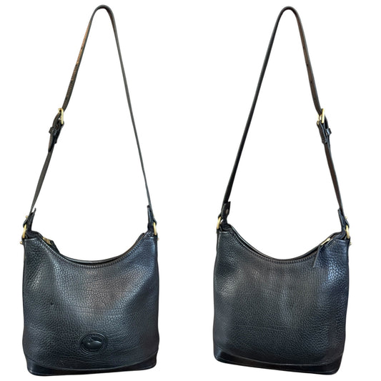 Front and back of Black leather handbag with a strap on a white background