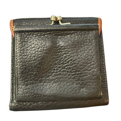 Back of Black leather wallet with gold clasp on a white background