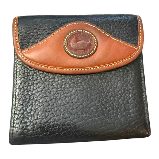 Front of Black leather wallet with brown flap and logo on a white background