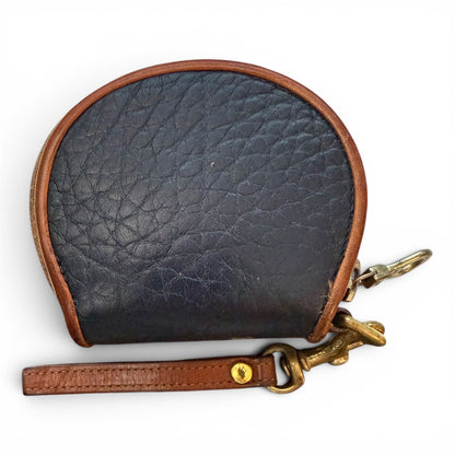 Black leather coin purse with brown strap and gold clasp on a white background