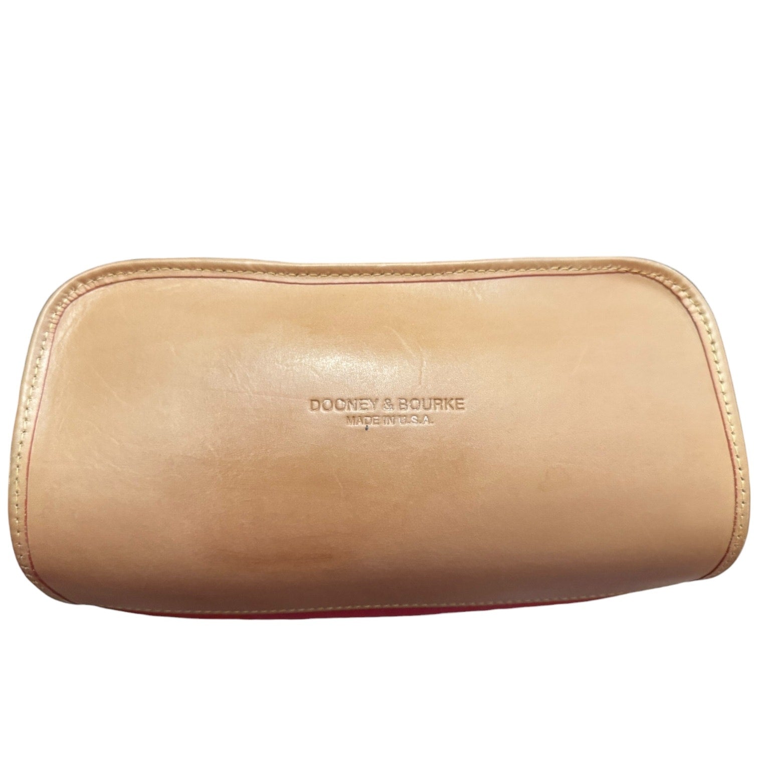 Bottom of leather purse with 'Dooney & Bourke' branding on a white background