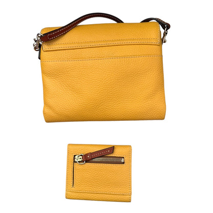 A yellow pebbled leather crossbody bag with a brown leather strap, shown alongside a matching small zippered wallet on a plain white background.