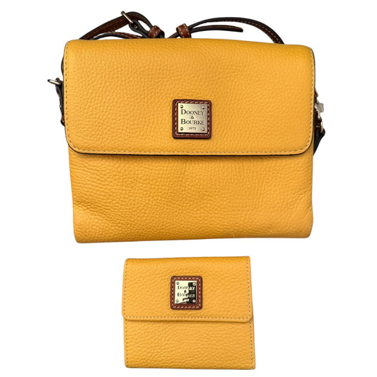 A yellow pebbled leather crossbody bag with a matching wallet, both featuring a brown leather and silver logo patch .