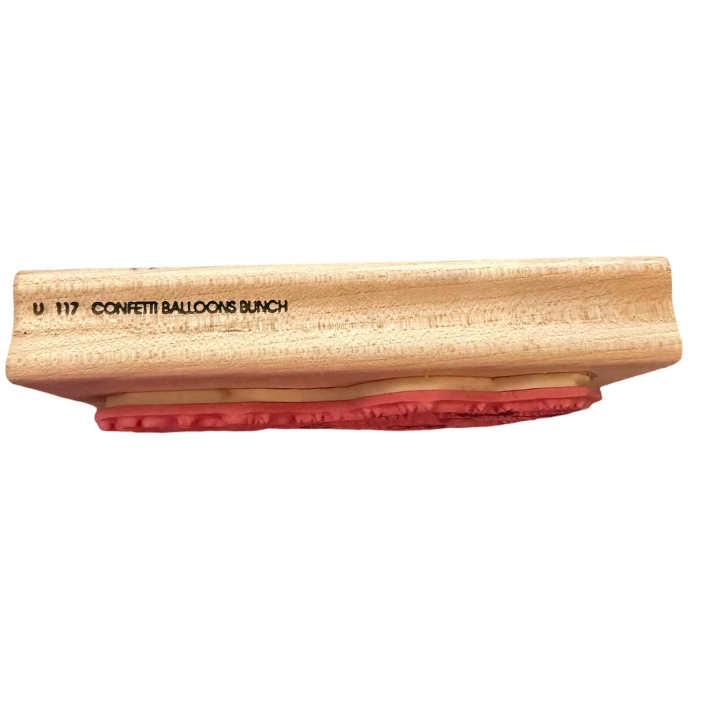 Wooden stamp with red pad on a white background