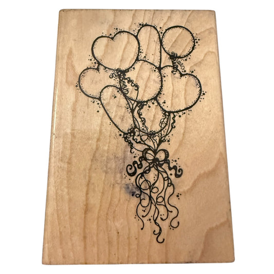 Wooden block with black heart-shaped balloons design