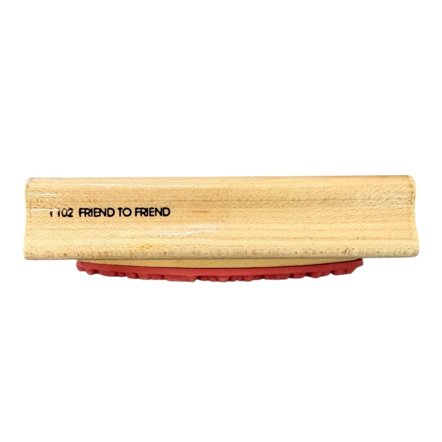 Wooden block with red rubber side and 'FRIEND TO FRIEND' branding on a white background