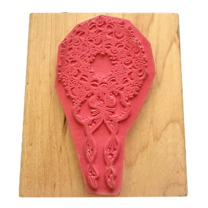 Pink decorative stamp on a wooden board