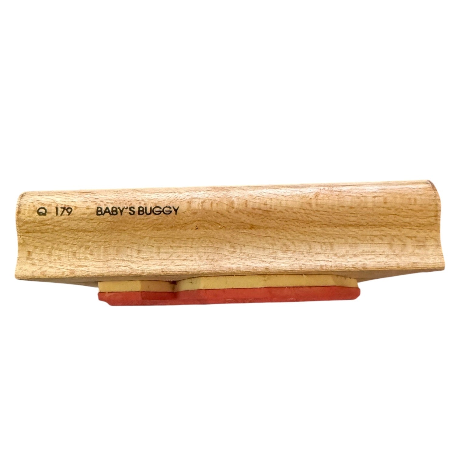 Wooden block with 'BABY'S BUGGY' branding on a white background