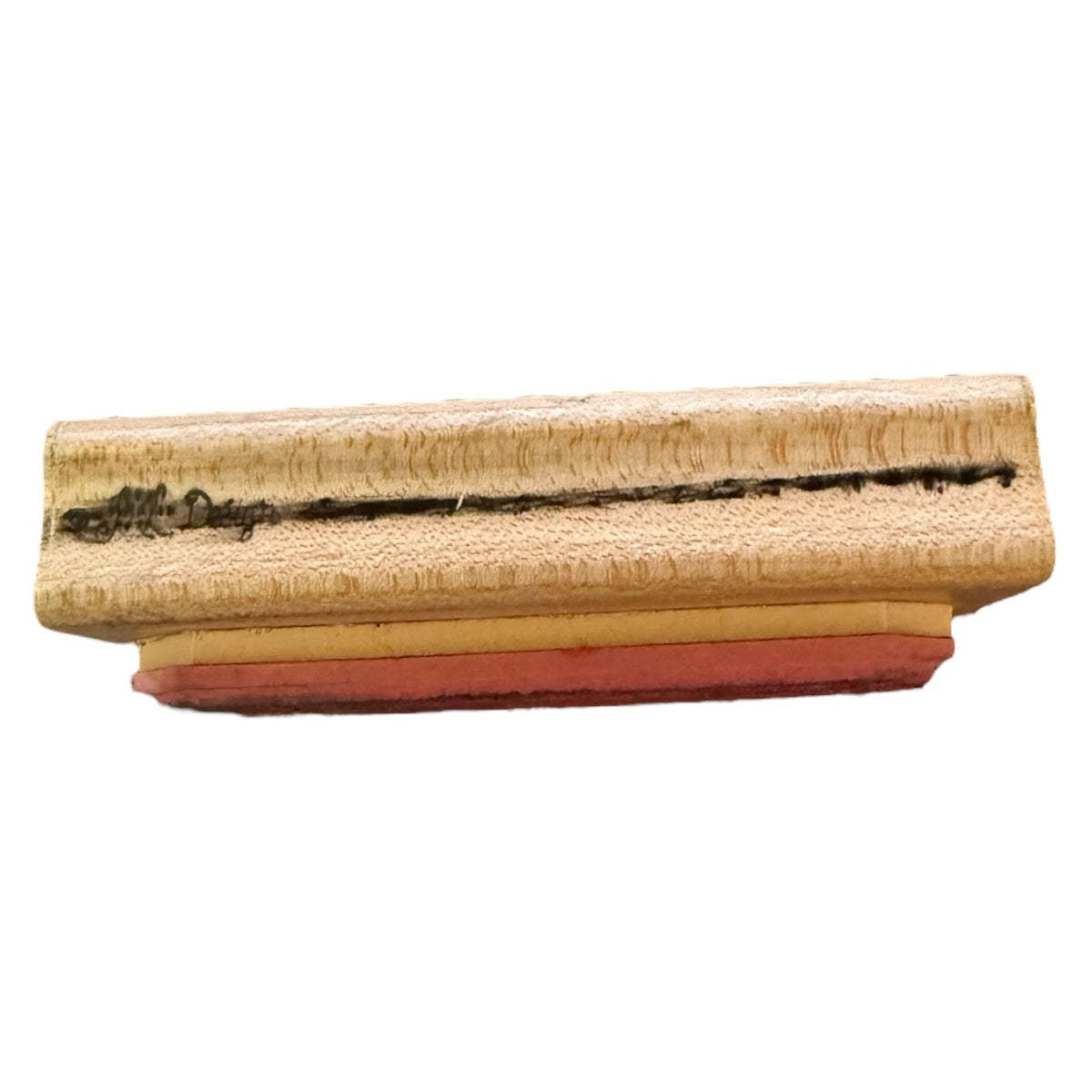 A rectangular wooden stamp block with a dark engraved design and a red rubber stamp face, shown against a plain white background.