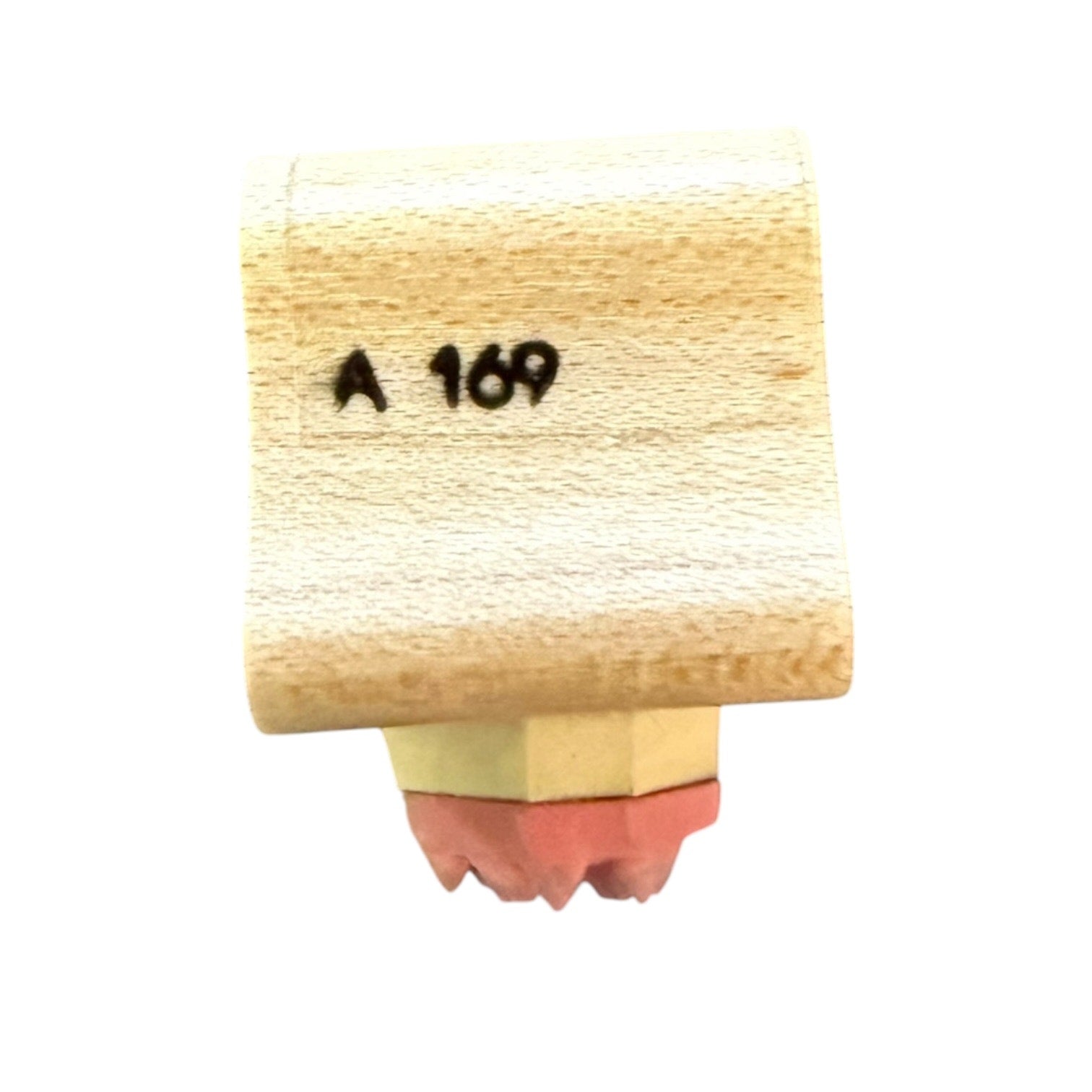 Wooden stamp with 'A 169' text on a white background