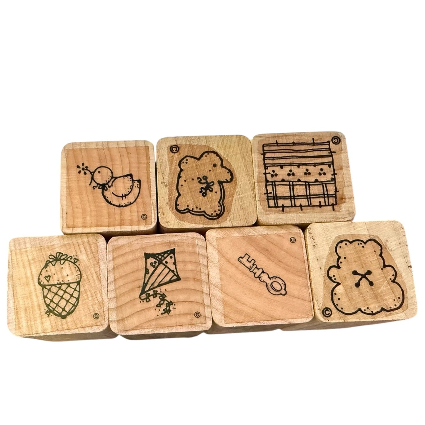 Set of wooden stamps with various designs on a white background