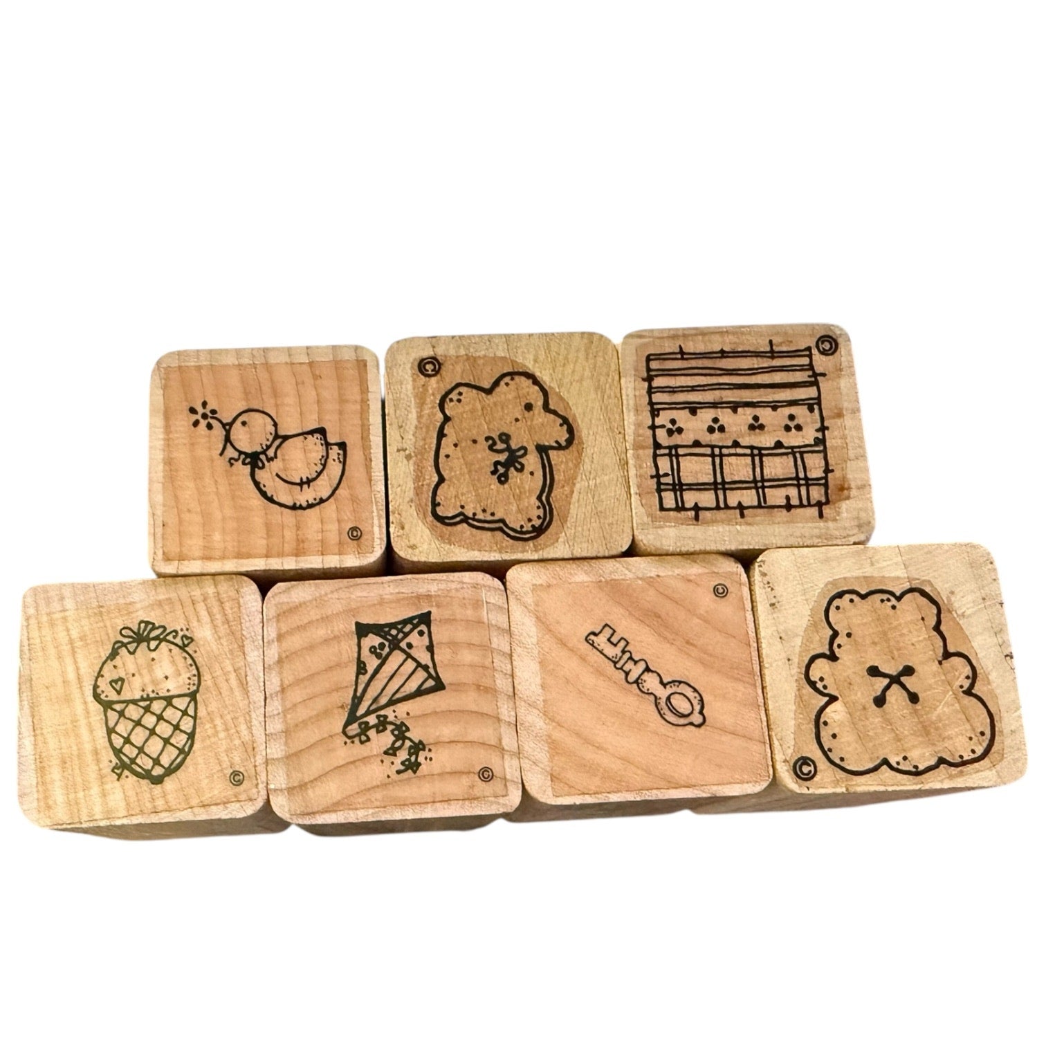 Set of wooden stamps with various designs on a white background