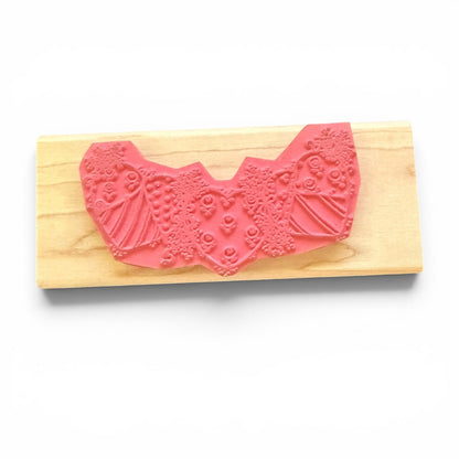 Pink hearts stamp on a wooden block