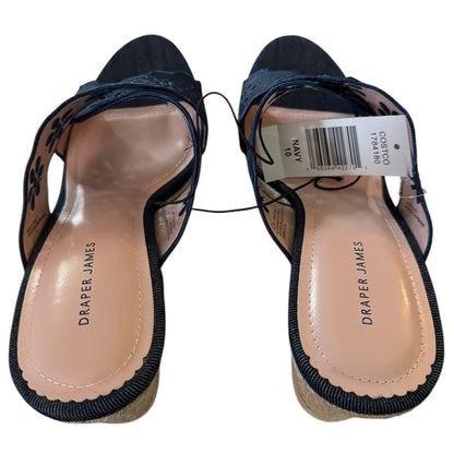Top of Navy heels with a Draper James tag on a white background