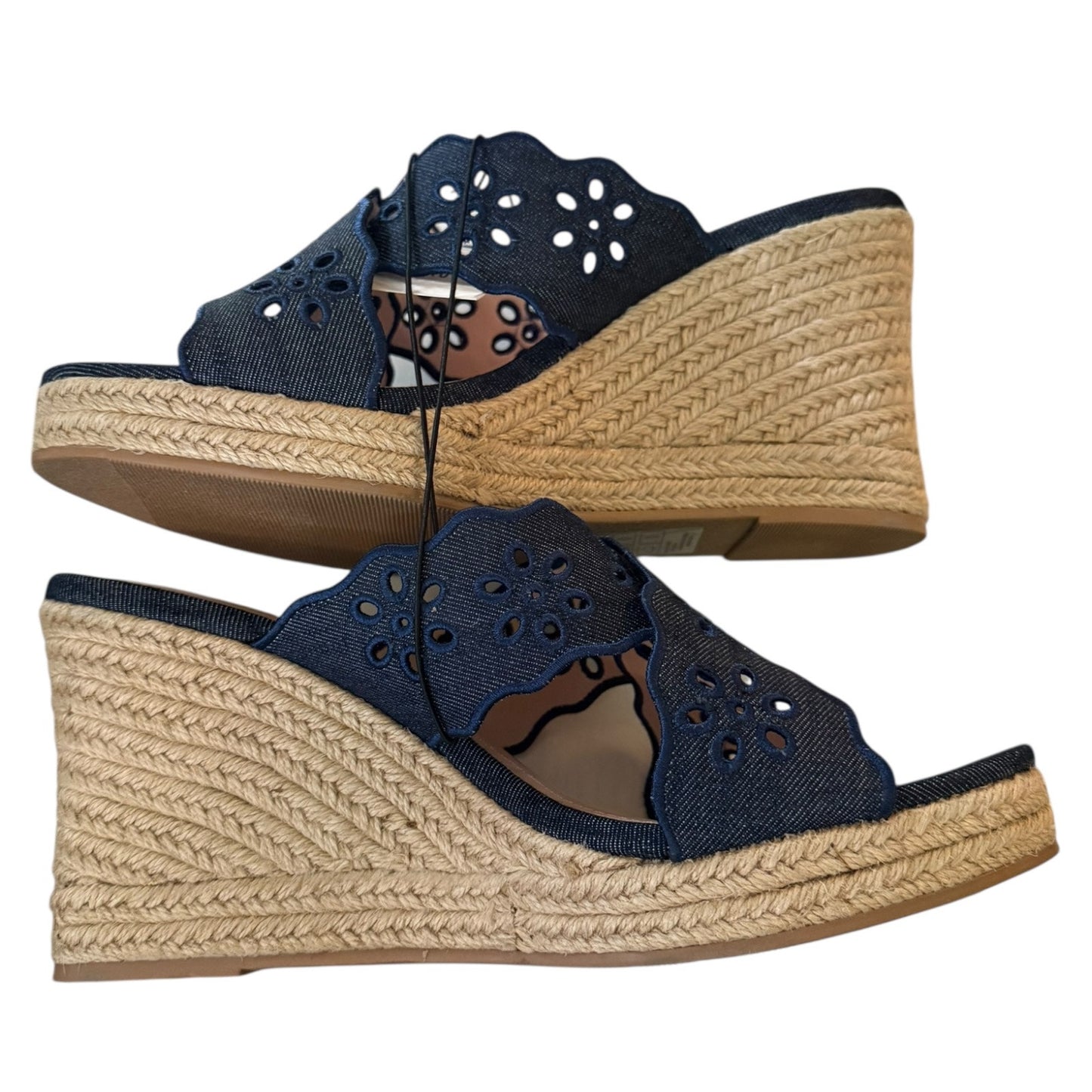 Side view of Navy wedge sandals on a white background