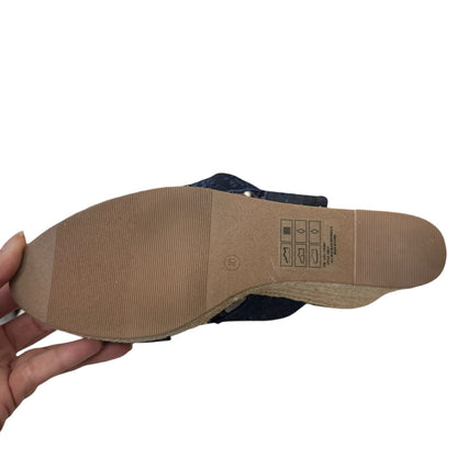 Shoe sole being held with a white background