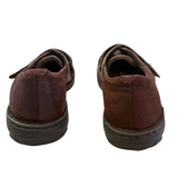 Back of brown shoes on a white background