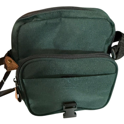 Interior of Green shoulder bag with a strap on a white background
