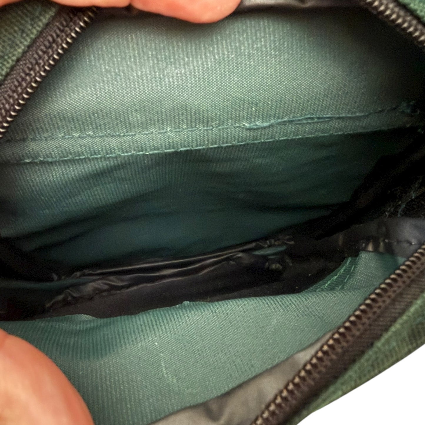 Green bag interior with a zipper