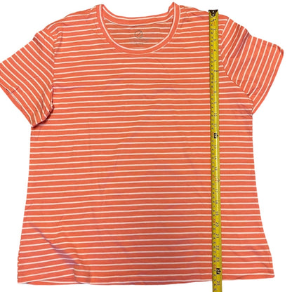 Orange and white striped t-shirt with a measuring tape on a white background