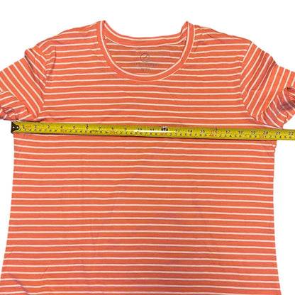 Orange and white striped t-shirt with a measuring tape on a white background