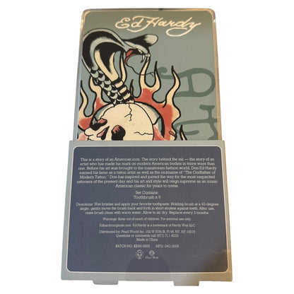 Ed Hardy toothbrush packaging with graphic design and text on a white background