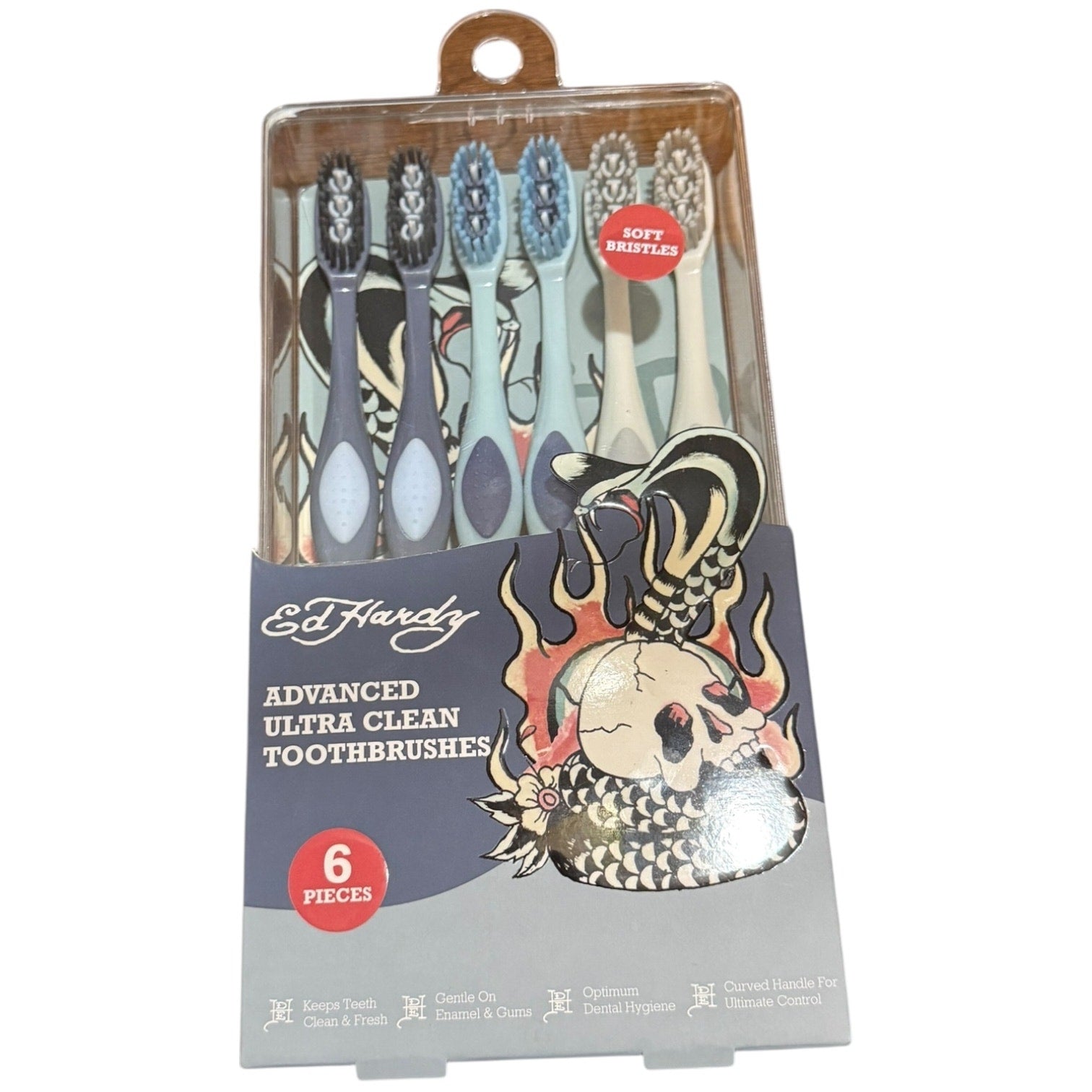 Pack of Ed Hardy toothbrushes with colorful design on packaging