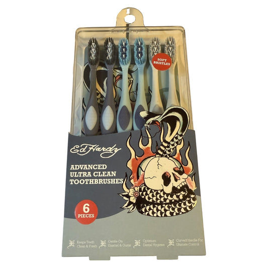 Pack of Ed Hardy toothbrushes with a skull and snake design on packaging.