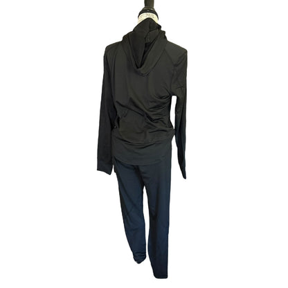 A black long-sleeve hooded jumpsuit displayed on a mannequin against a plain white background.
