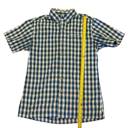 Blue and white shirt laying flat with a yellow measuring tape to show length on a white background