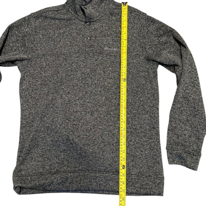 A gray long-sleeve quarter-zip pullover sweater shown flat against a white background, with a yellow tape measure standing vertically along the center to indicate size.