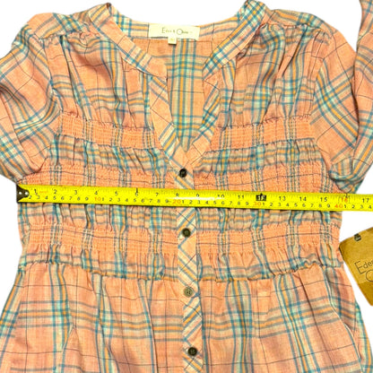Plaid shirt with a measuring tape on top, Edwards & Company label visible