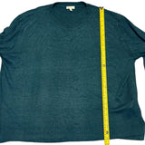 Green sweater with a yellow measuring tape on a white background
