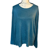 Front of green sweater on a mannequin with a white background