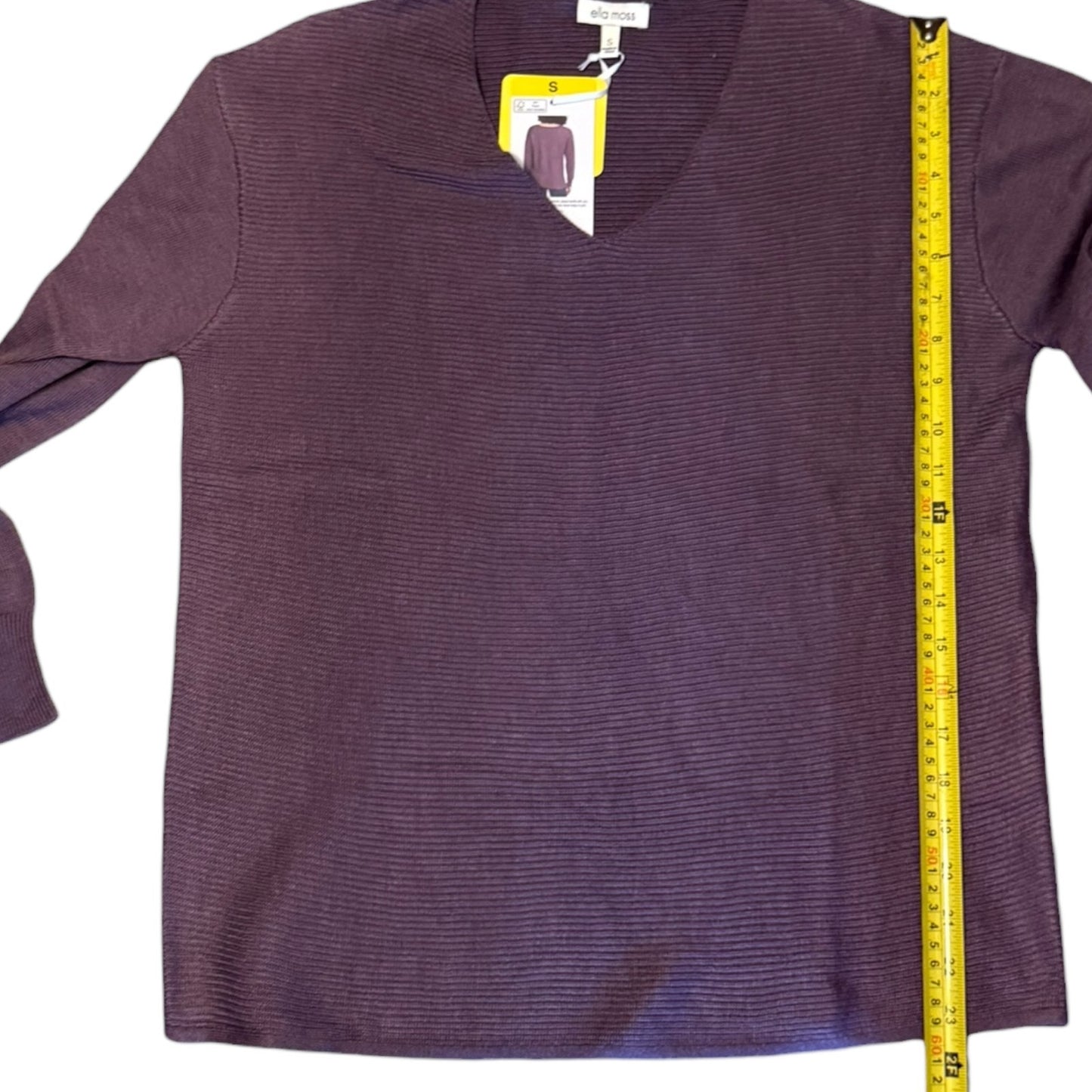 Purple sweater with a measuring tape on a white background